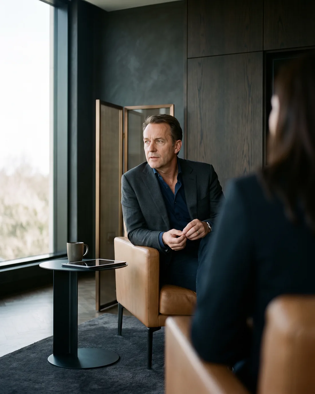 A senior CHRO reviewing the work in a calm Vancouver boardroom